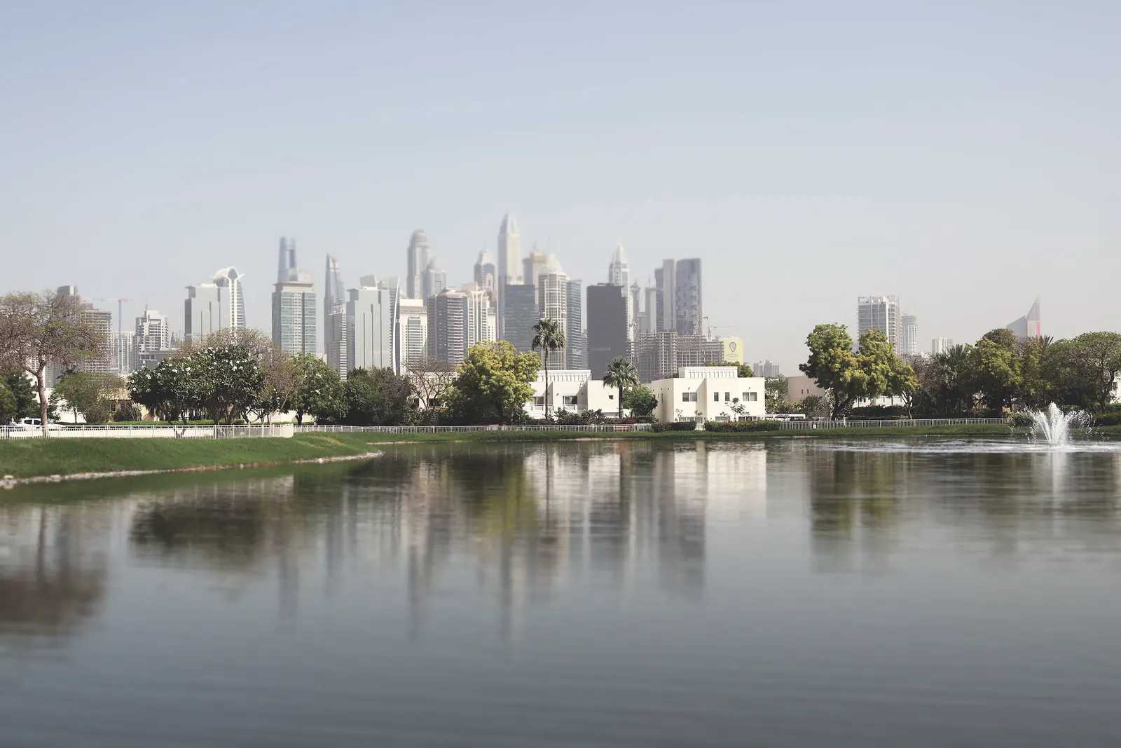 Towers reflected in a still lake